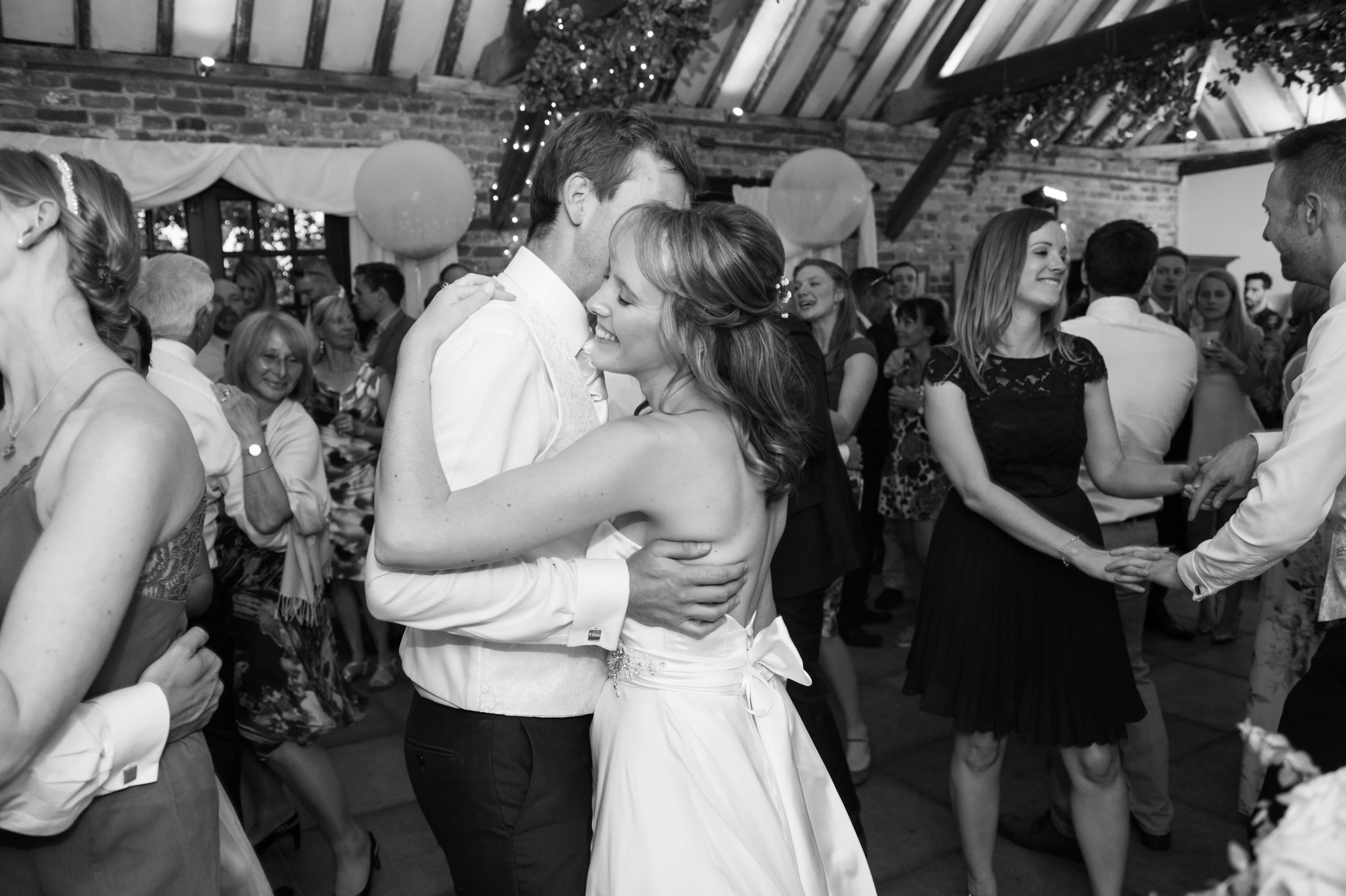 A black and white photograph of the bride and groomâ€™s first dance 